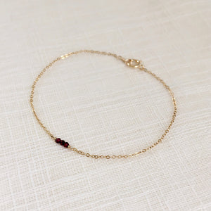 Tiny 14k gold gemstone bracelet