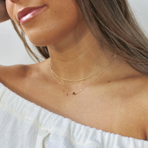 Dainty garnet necklace in 14k gold